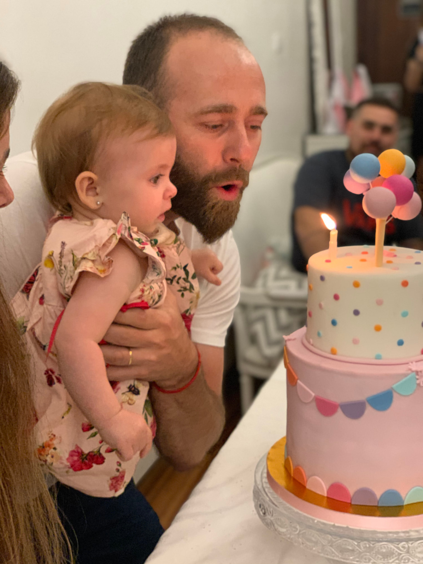 Soplando la velita del primer añito